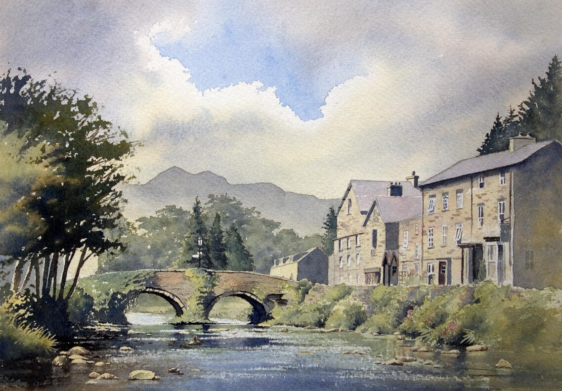Watercolour painting of Beddgelert bridge – River Glaslyn leading to Snowdonia peaks and traditional Welsh cottages by Chris Hull.
